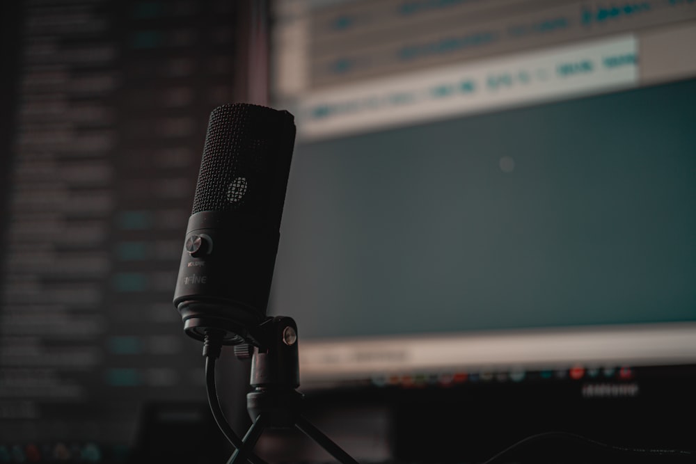 black microphone on black microphone stand