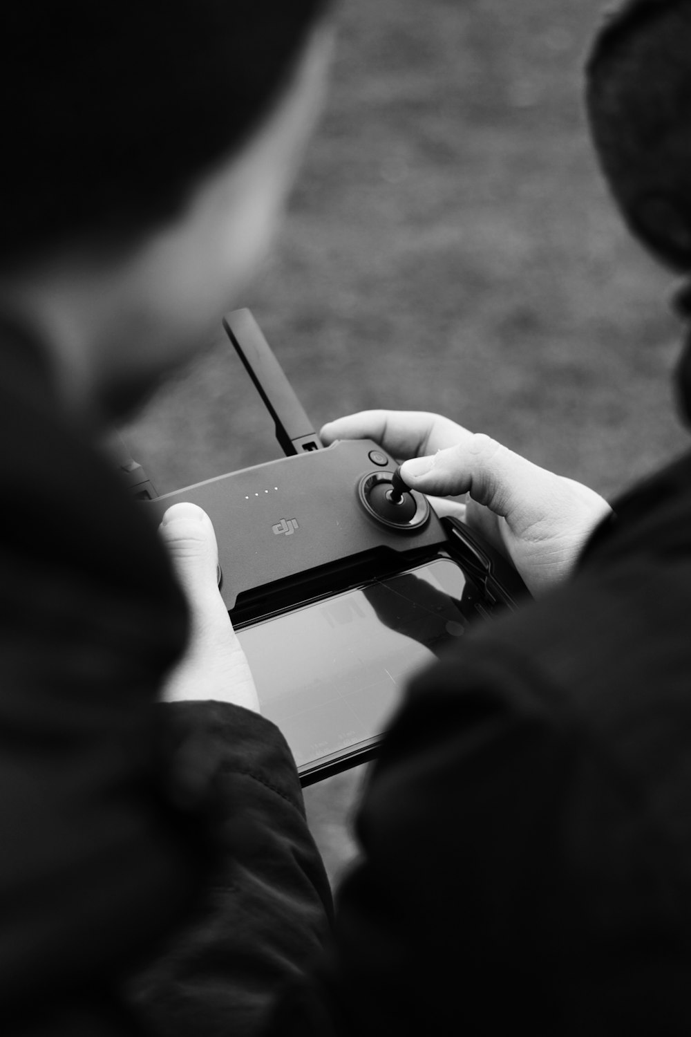 person holding black game controller