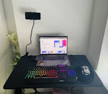 A cozy home office setup with a laptop displaying a dropshipping guide.