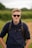 man in black long sleeve shirt wearing black sunglasses