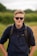 man in black long sleeve shirt wearing black sunglasses