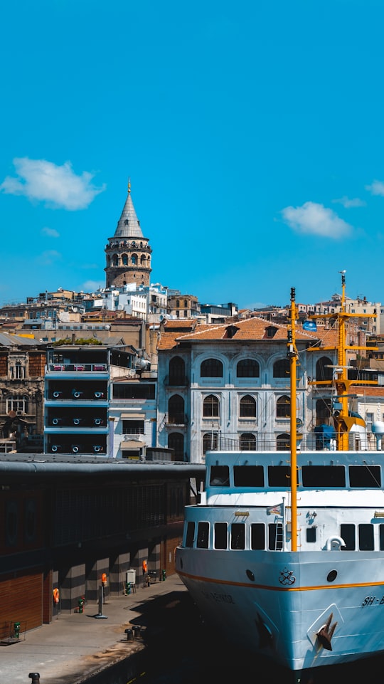 white and brown concrete building under blue sky during daytime in Karaköy Turkey