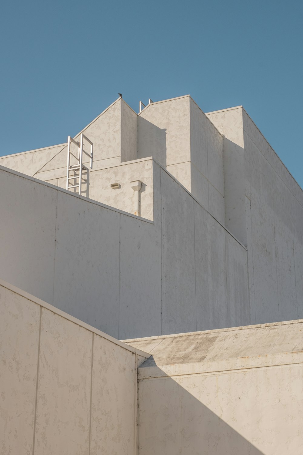 gray concrete building under blue sky during daytime