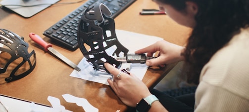 person holding black and white star wars r 2 d 2 toy