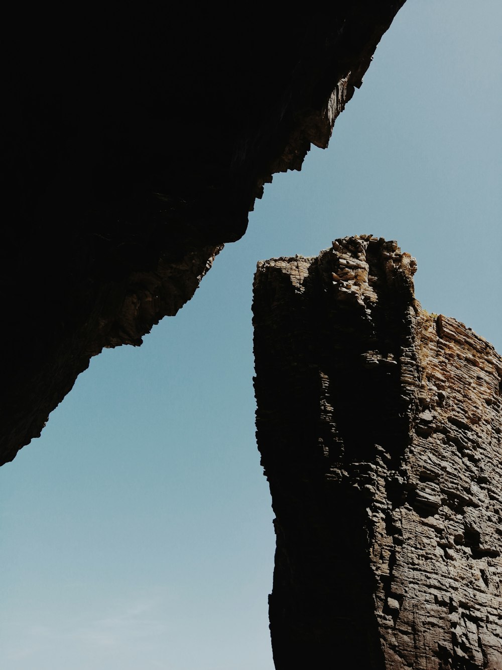 brown rock formation under blue sky during daytime