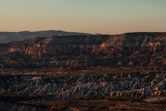 brown rocky mountain under gray sky during daytime in Cappadocia Turkey