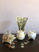 white ceramic teapot beside white ceramic teapot