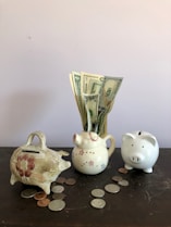 white ceramic teapot beside white ceramic teapot