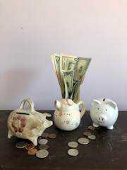 white ceramic teapot beside white ceramic teapot