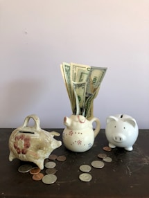 white ceramic teapot beside white ceramic teapot