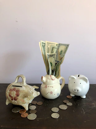 white ceramic teapot beside white ceramic teapot