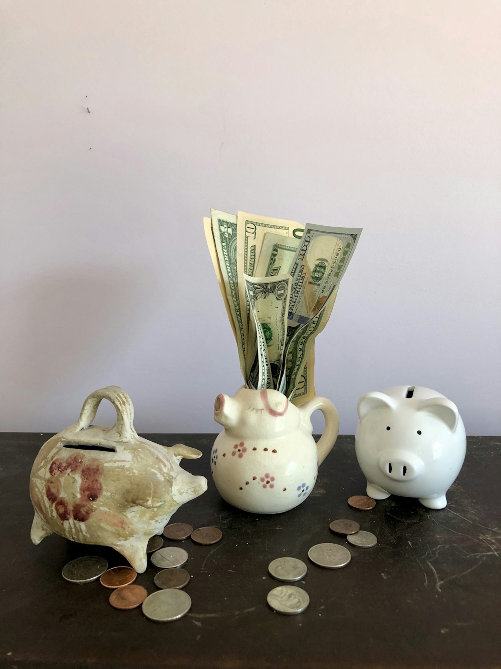 white ceramic teapot beside white ceramic teapot