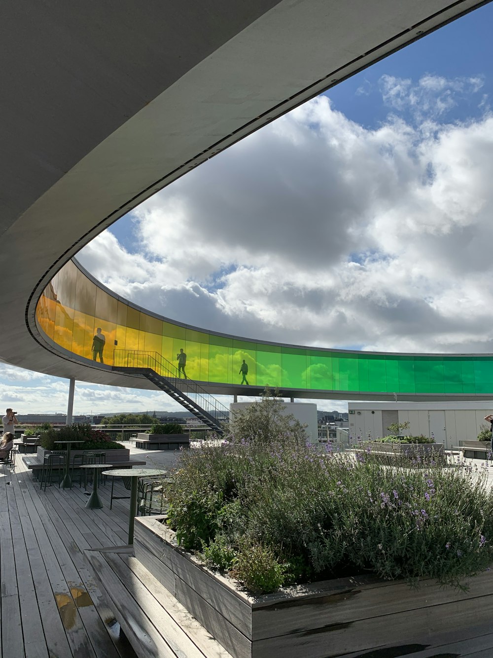 green and yellow round outdoor fountain under white clouds during daytime