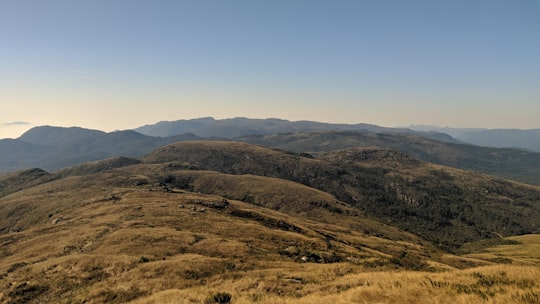 brown and green mountains under blue sky during daytime in Tijucas do Sul - PR Brasil