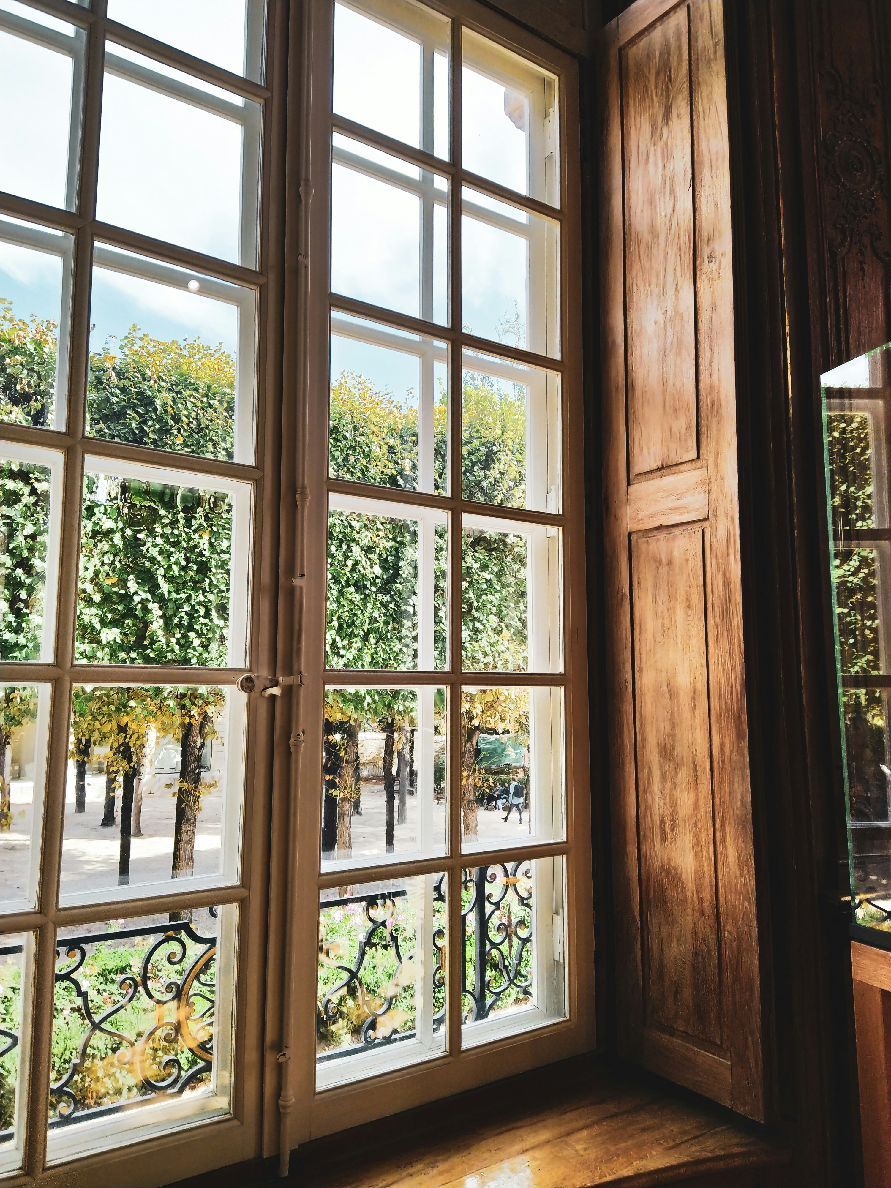 brown wooden framed glass window