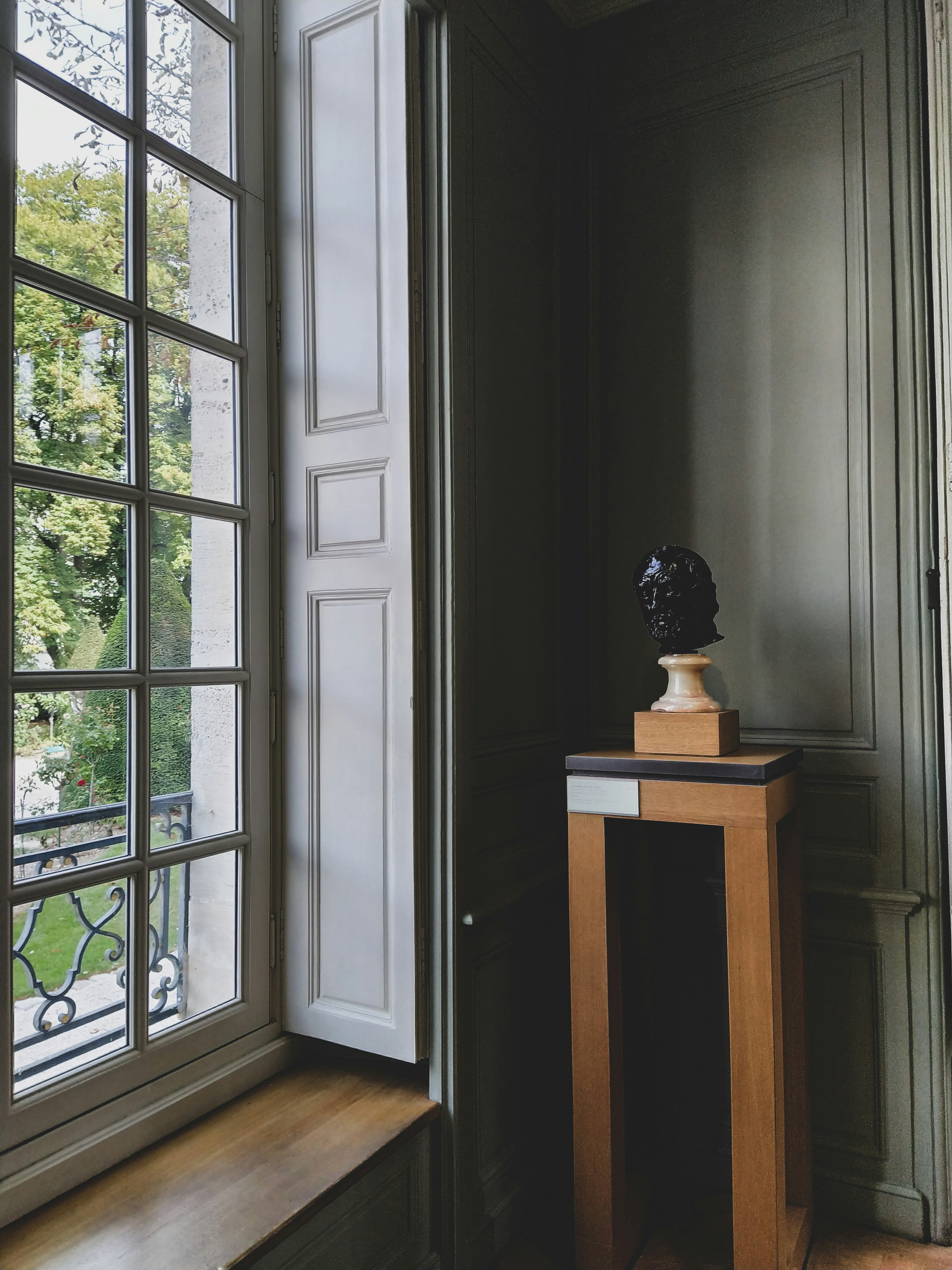 brown wooden table near window