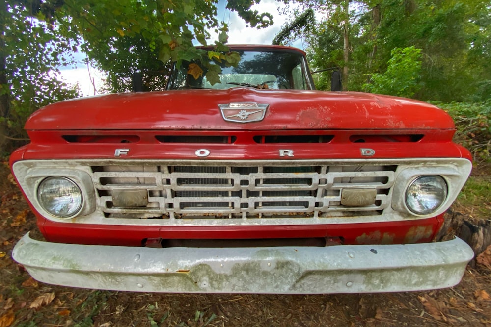 red chevrolet car on snow covered ground