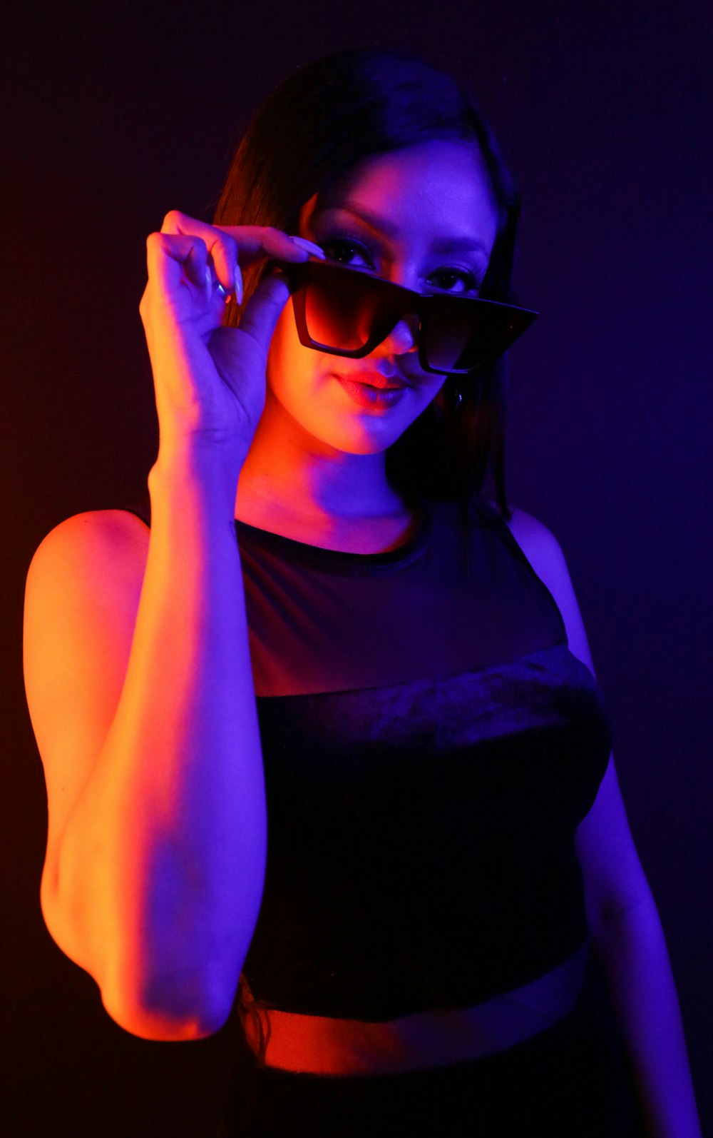 woman in black tank top wearing black sunglasses