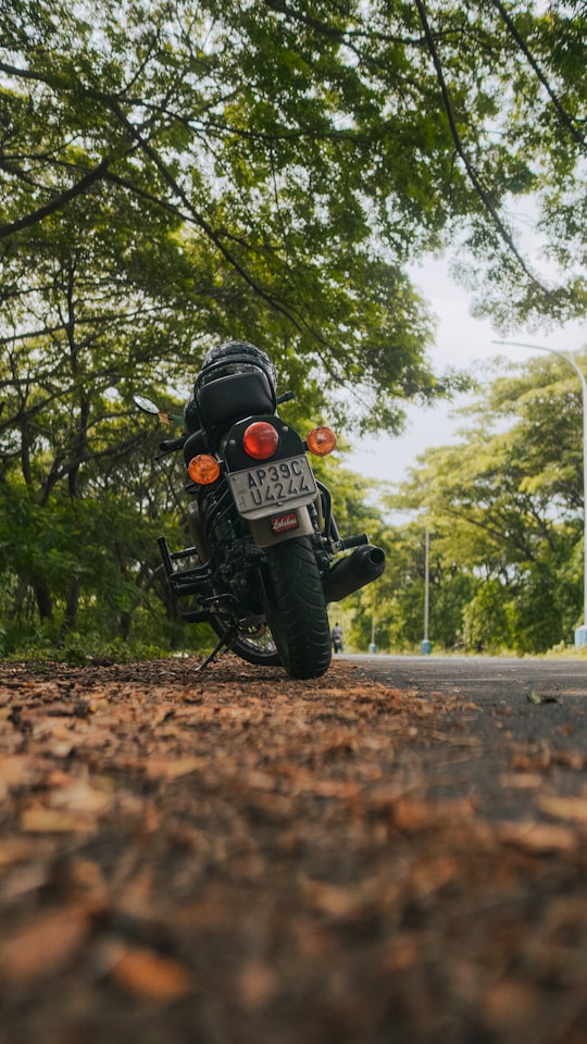 man in black motorcycle helmet riding motorcycle on road during daytime in Visakhapatnam India