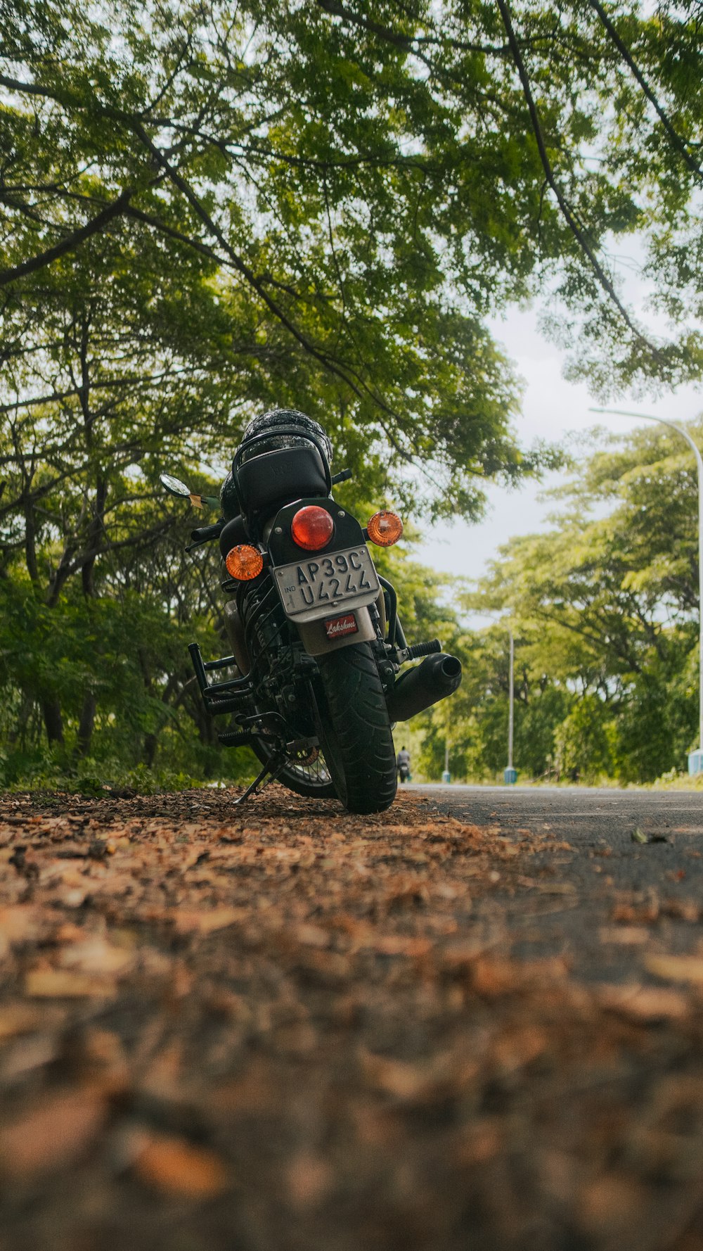 man in black motorcycle helmet riding motorcycle on road during daytime