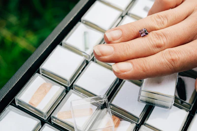person holding clear glass mirror