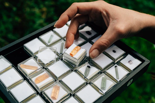 Boxes labeled and prepared for national and international shipping, surrounded by sparkling crystals.
