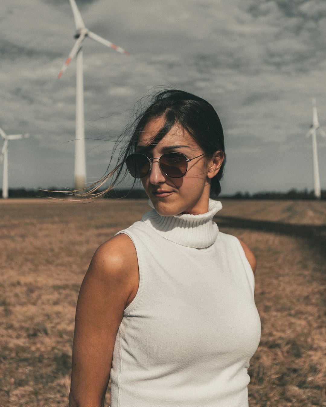 woman in white tank top wearing black sunglasses