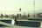 A group of skaters performing tricks at a vibrant skate park.