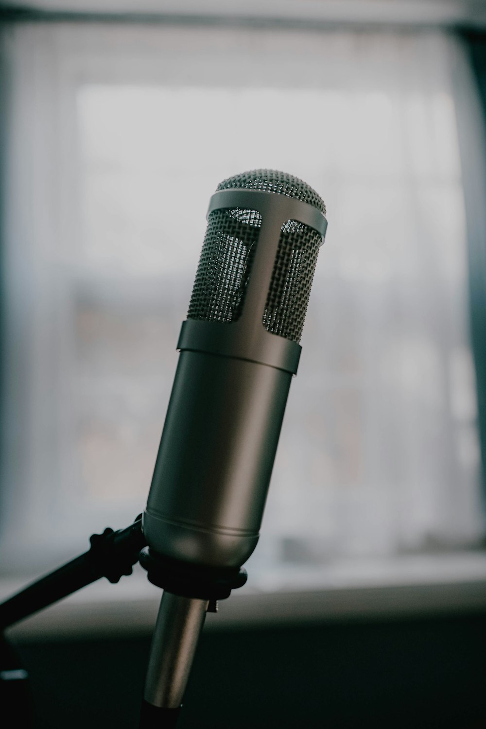 black microphone on black stand