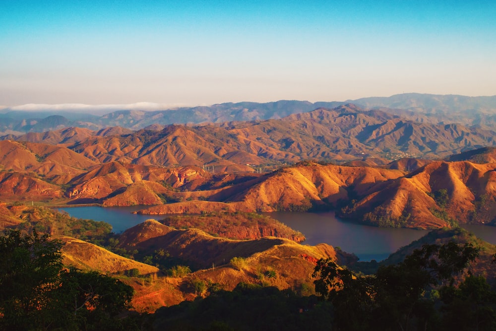 aerial view of brown mountains and river during daytime