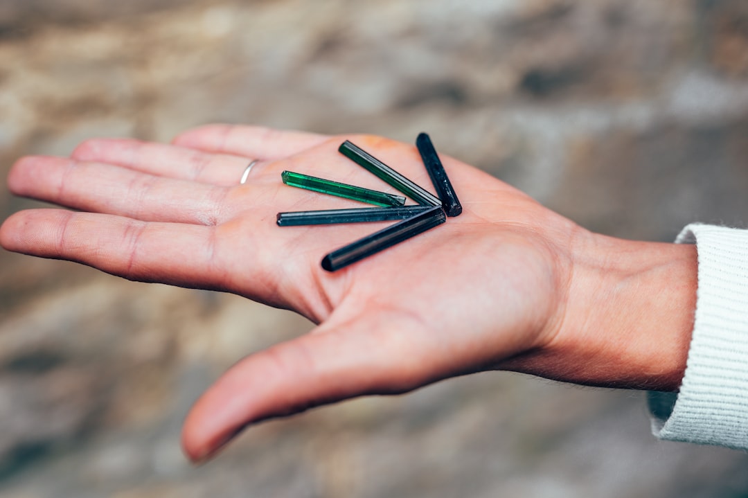 black stick on persons hand