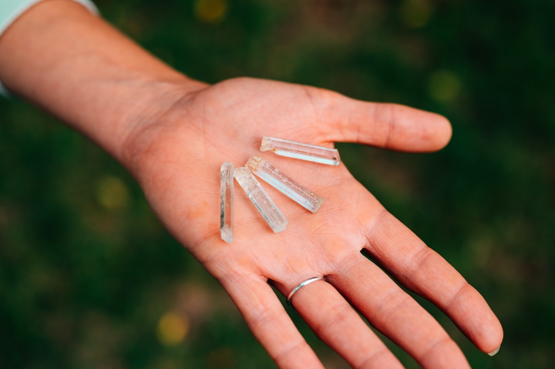 person holding white plastic tube