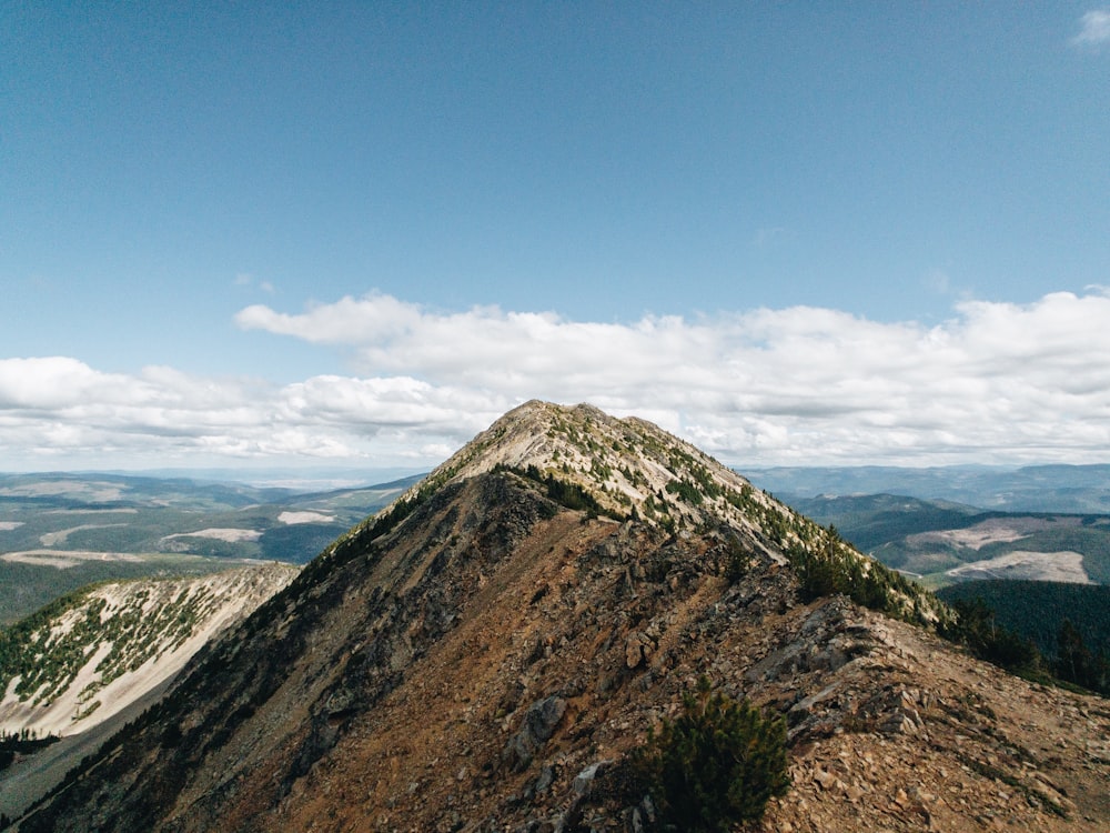 green and brown mountain under blue sky during daytime