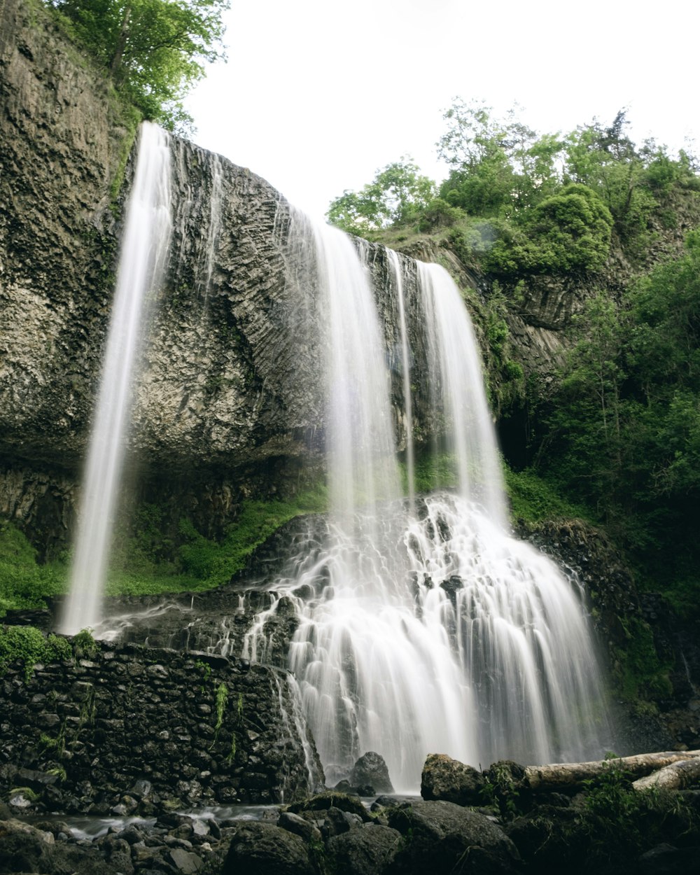 waterfalls in the middle of the forest