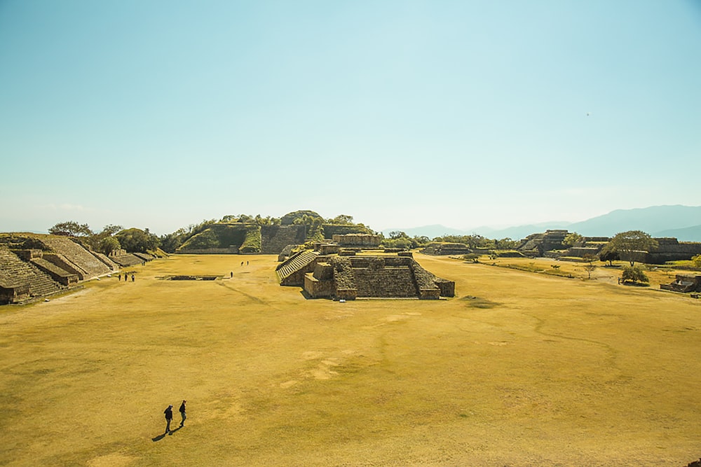 brown concrete building on brown field during daytime