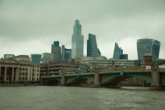 brown concrete bridge over river during daytime