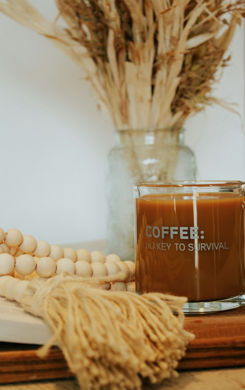 clear glass jar with brown liquid inside