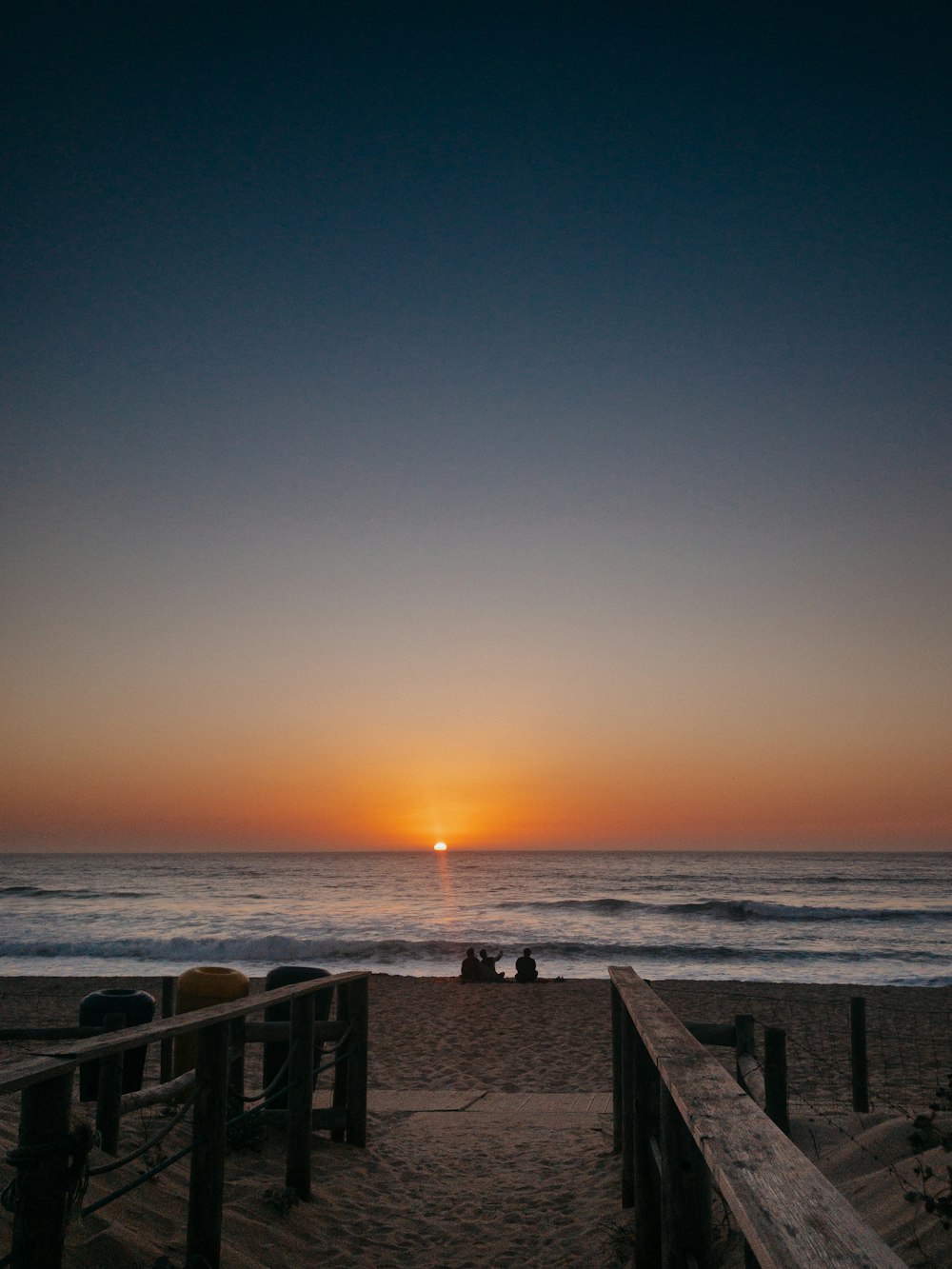 people on beach during sunset