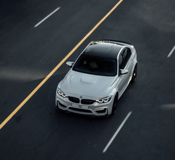 white bmw m 3 on road