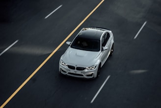 white bmw m 3 on road