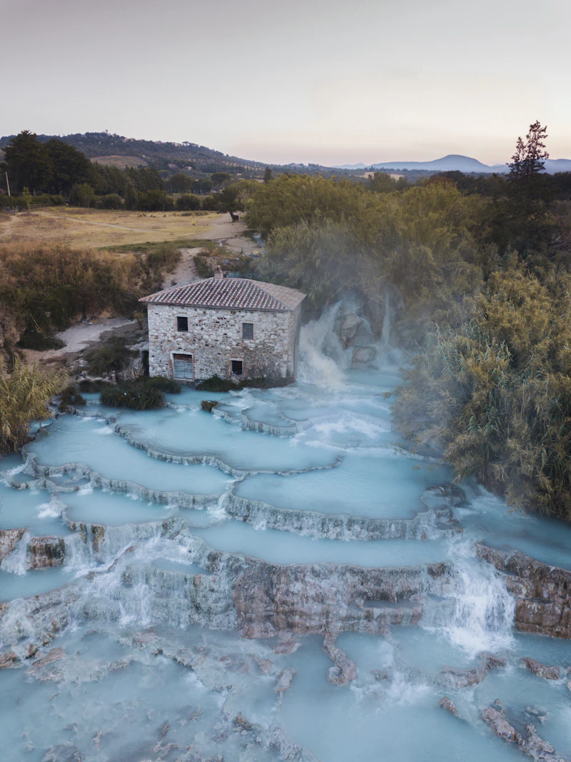 Saturnia travertine terraces with milky blue cascading water