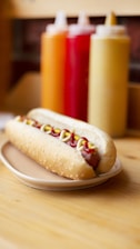 foot long hotdog with condiments on a plate