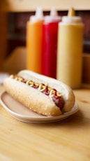 foot long hotdog with condiments on a plate