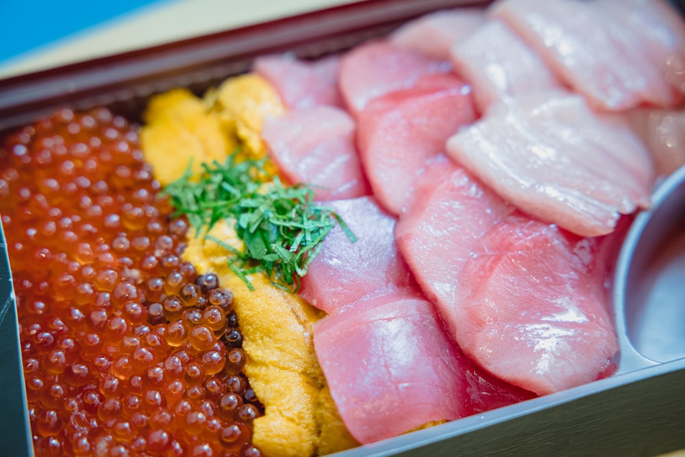 sliced meat on stainless steel tray