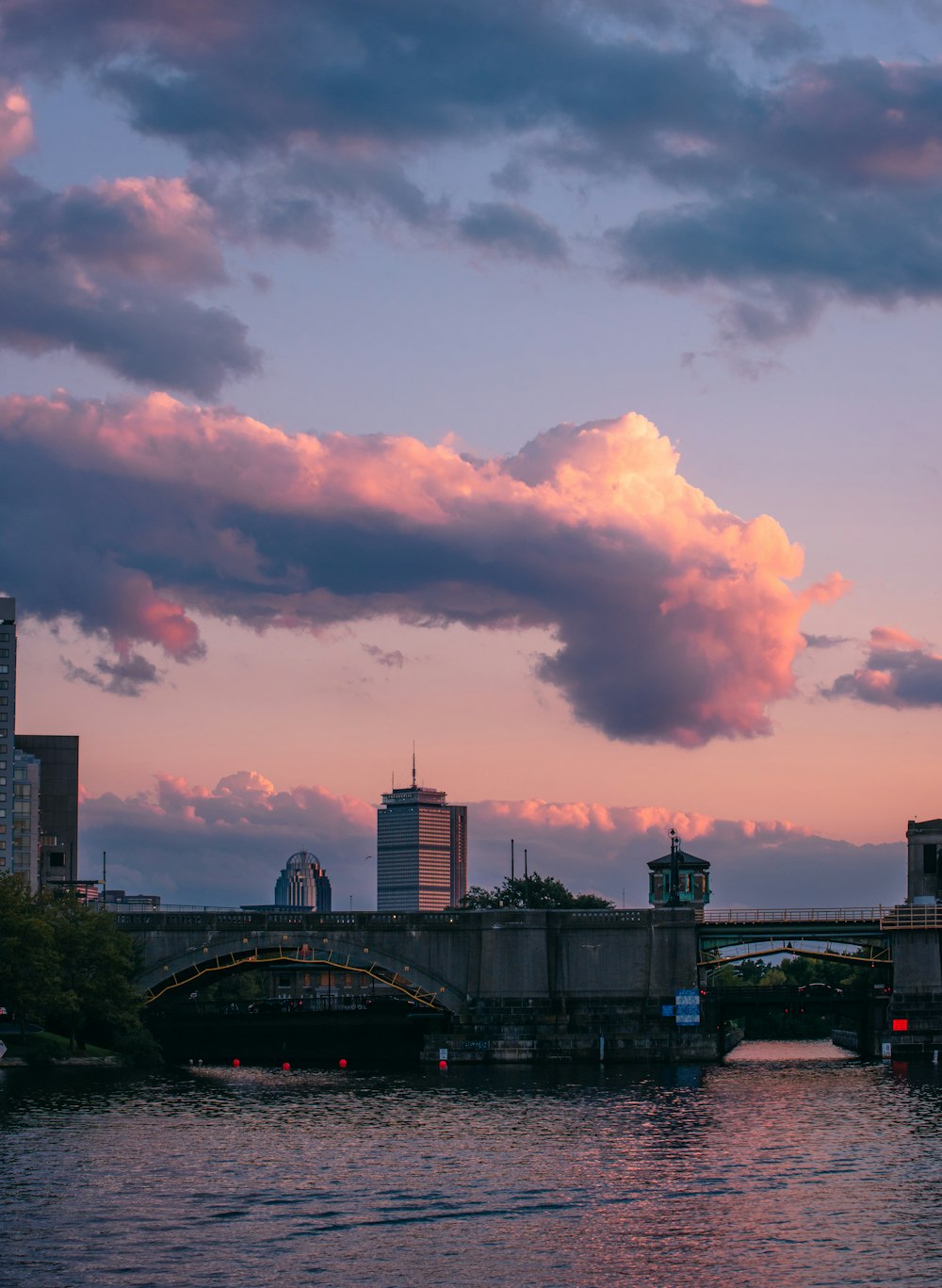 city skyline under cloudy sky during daytime