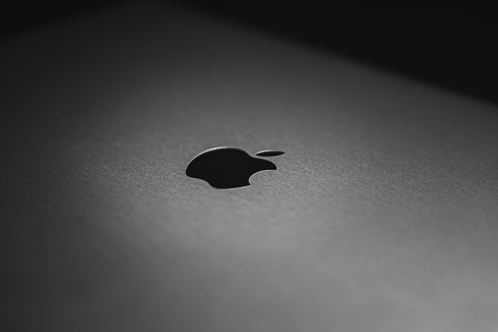 black apple logo on black surface