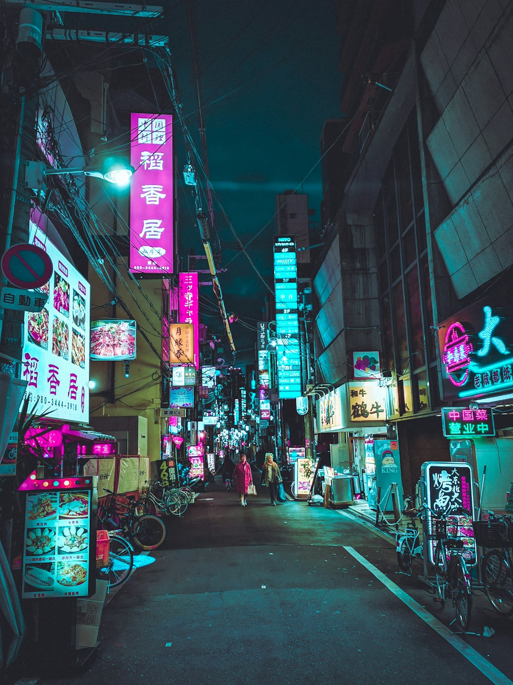 people walking on street during night time