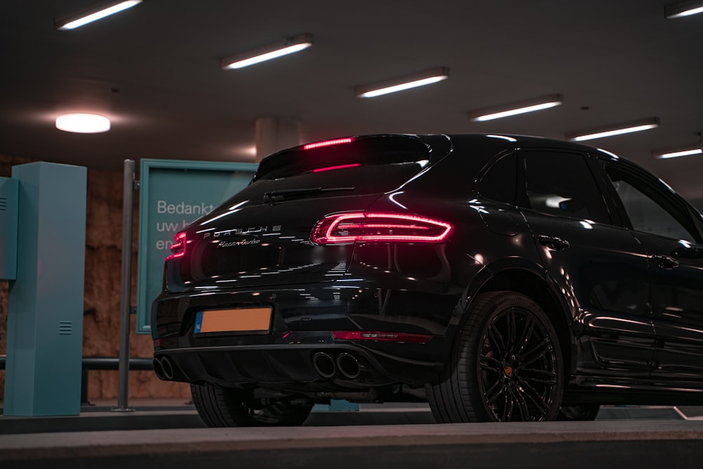 black and red car in a garage