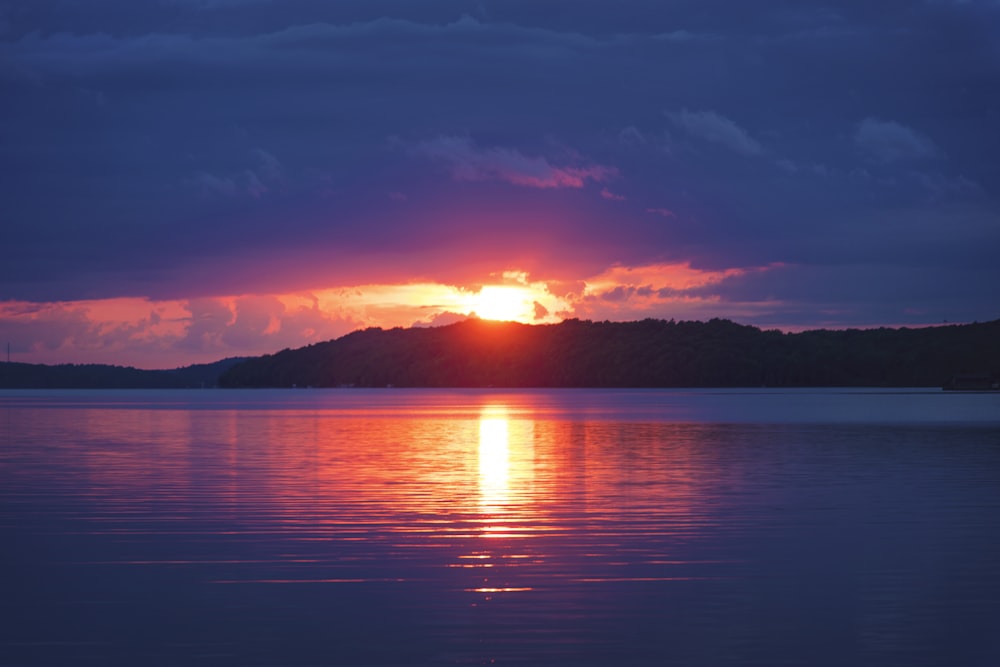 body of water during sunset