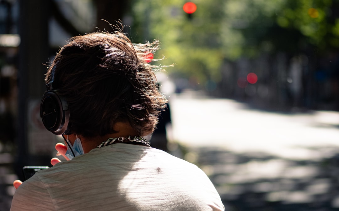 woman in white shirt looking at the road during daytime